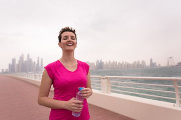 Image showing young woman celebrating a successful training run