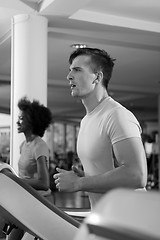 Image showing sportsman exercise jogging on treadmill