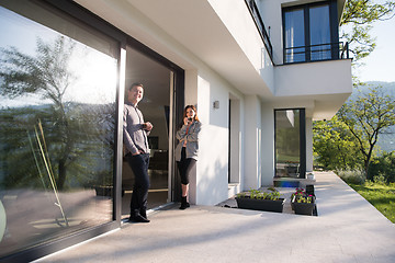 Image showing couple enjoying on the door of their luxury home villa