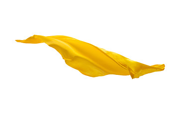 Image showing Smooth elegant transparent yellow cloth separated on white background.