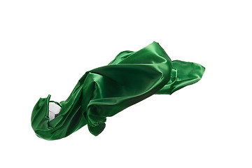 Image showing Smooth elegant transparent green cloth separated on white background.