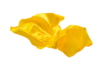 Image showing Smooth elegant transparent yellow cloth separated on white background.