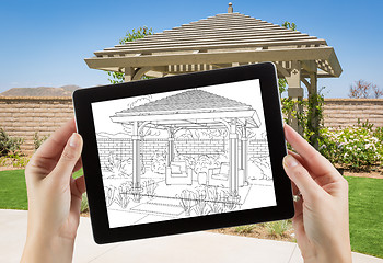 Image showing Female Hands Holding Computer Tablet with Drawing of Pergola on 