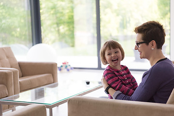 Image showing mother and cute little girl enjoying their free time