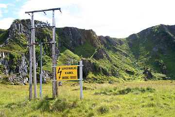 Image showing Electric mast and mountain