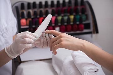 Image showing Woman hands receiving a manicure