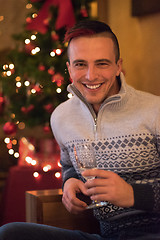 Image showing Happy young man with a glass of champagne