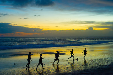 Image showing Football on the beach. silhouette