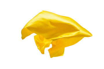 Image showing Smooth elegant transparent yellow cloth separated on white background.