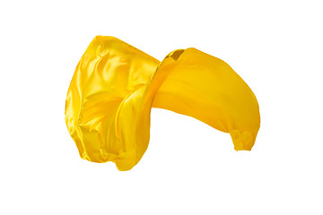 Image showing Smooth elegant transparent yellow cloth separated on white background.