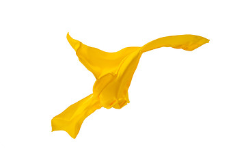 Image showing Smooth elegant transparent yellow cloth separated on white background.