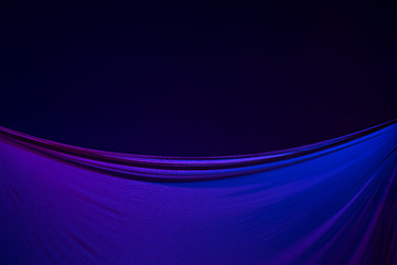 Image showing Smooth elegant transparent blue cloth separated on blue background.