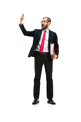 Image showing Happy businessman talking on the phone with folder in hand isolated over white background in studio shooting