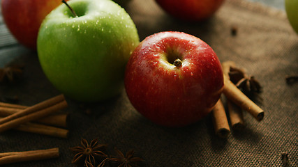 Image showing Apples and spices on table 