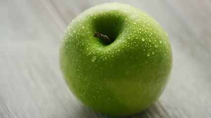 Image showing Green ripe apple with water drops 