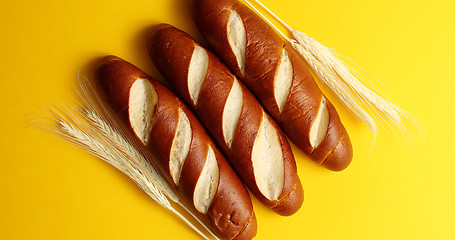 Image showing Golden baguettes with wheat ears