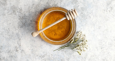 Image showing Bowl of honey with spindle