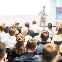 Image showing Business speaker giving a talk at business conference event.