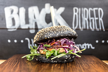 Image showing Burger beeing sold on international urban street food festival.