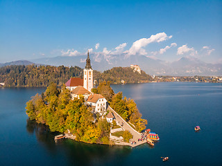 Image showing Aerial view of Bled island on lake Bled, and Bled castle and mountains in background, Slovenia.