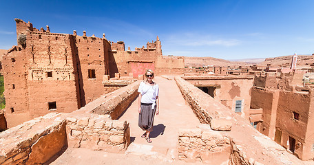 Image showing Woman on travel at Ait Benhaddou kasbah, Ouarzazate, Morocco.