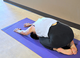 Image showing Female doing yoga exercises.