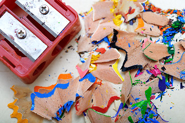 Image showing Sharpener and colored pencil shavings