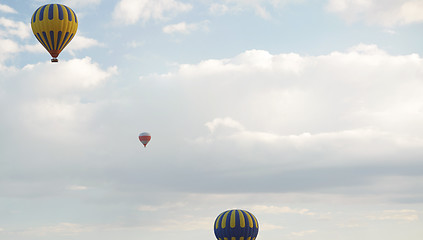 Image showing Three air balloons flying in the sky