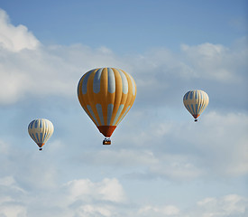 Image showing Three air balloons flying in the sky