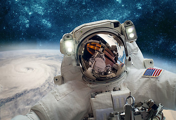 Image showing Astronaut in outer space against the backdrop of the planet eart