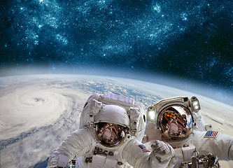 Image showing Astronaut in outer space against the backdrop of the planet eart