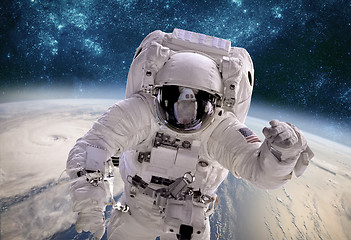 Image showing Astronaut in outer space against the backdrop of the planet eart