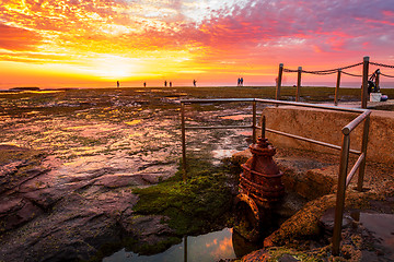 Image showing Sunrise and fisherman at Mona Vale Australia