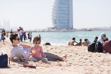 Image showing Mom and daughter on the beach