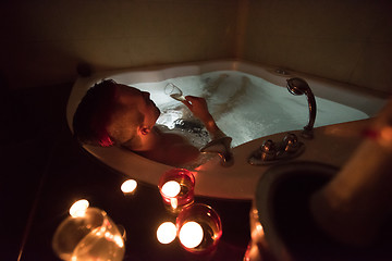 Image showing man relaxing in the jacuzzi