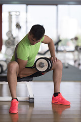 Image showing handsome man working out with dumbbells