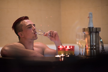 Image showing man relaxing in the jacuzzi