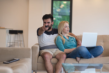 Image showing young happy couple relaxes in the living room