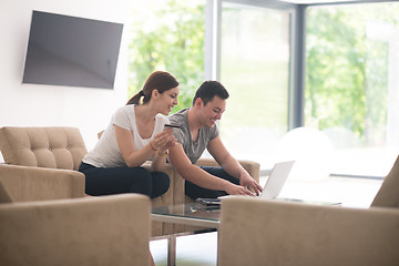 Image showing happy young couple buying online