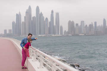 Image showing mother and cute little girl on the promenade