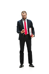 Image showing Happy businessman talking on the phone with folder in hand isolated over white background in studio shooting