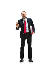 Image showing Angry businessman talking on the phone isolated over white background in studio shooting