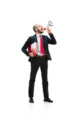 Image showing Side view of a man screaming on the megaphone over white background