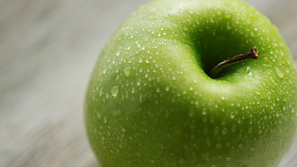 Image showing Green apple with water drops