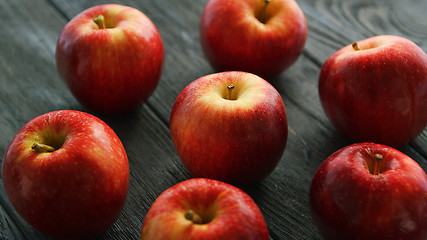 Image showing Ripe apples on wooden table 