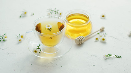 Image showing Herbal tea and jar of honey