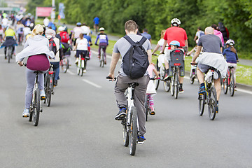 Image showing Bicyclists in traffic on the streets of the city