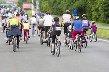 Image showing Bicyclists in traffic on the streets of the city