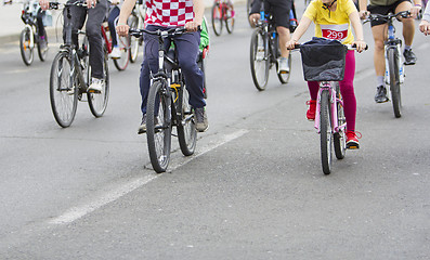 Image showing Bicyclists in traffic on the streets of the city