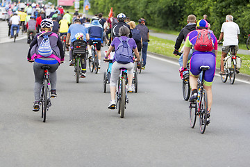 Image showing Bicyclists in traffic on the streets of the city